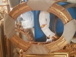 cornice ovale in legno oro foglia per