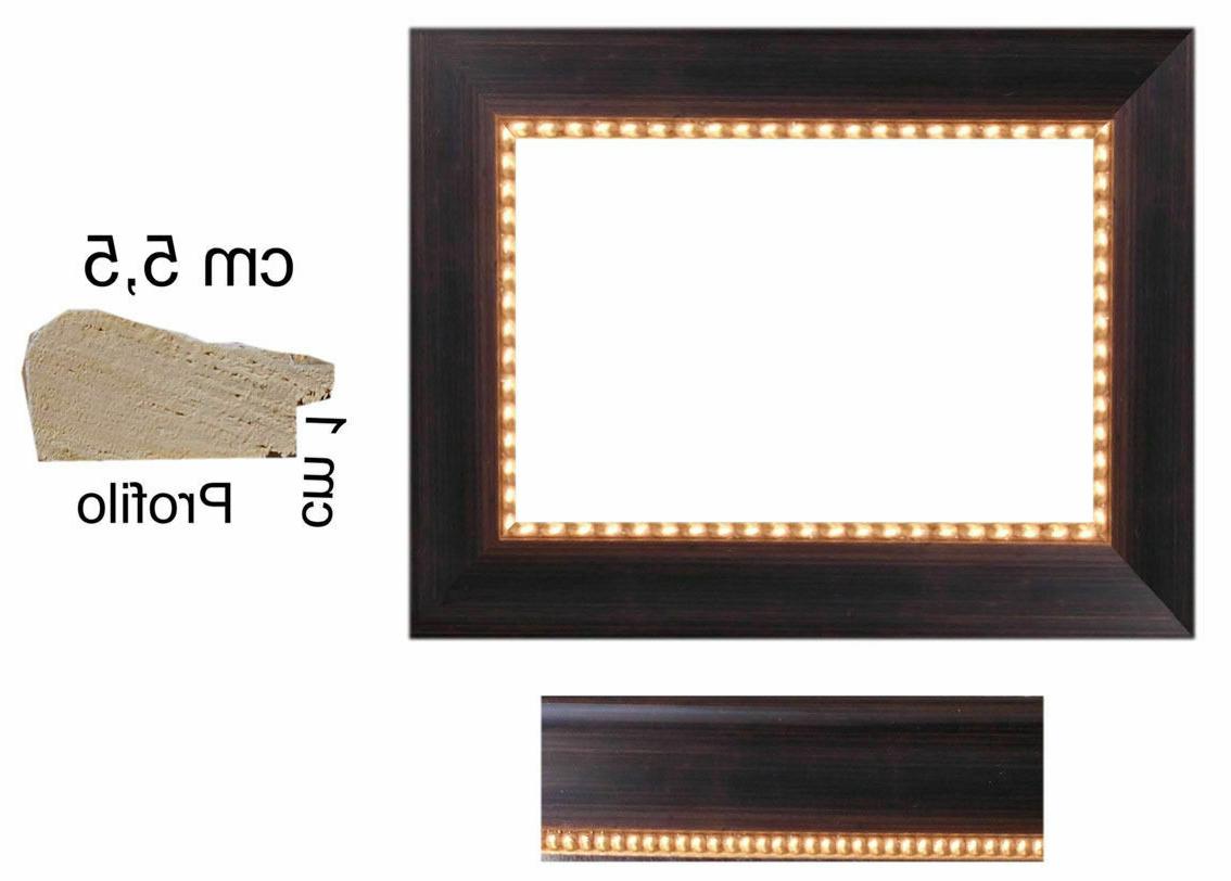 cornice in legno noce scuro a pallini