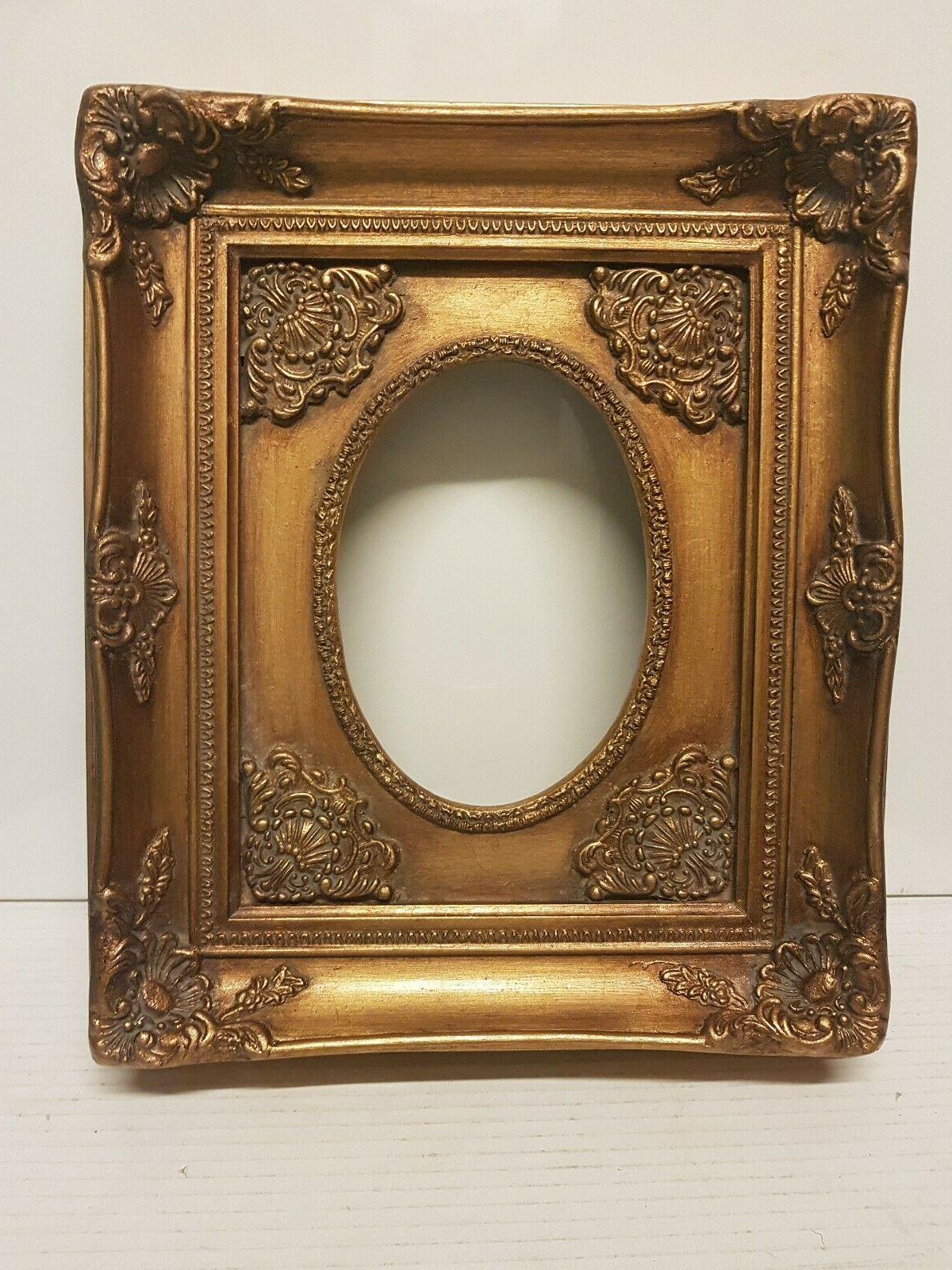 cornice ovale in legno foglia oro per